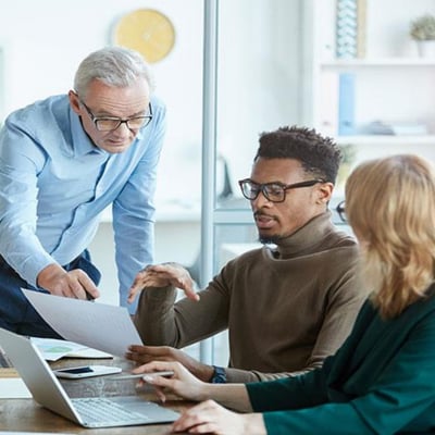 Facility manager reviewing secure digital dashboard for cybersecurity compliance