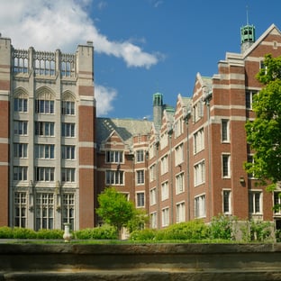 School maintenance team inspecting HVAC system in classroom