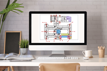 School administrator reviewing interactive digital floor plan on a tablet