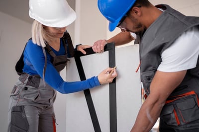 School facility manager reviewing digital work order system on a tablet