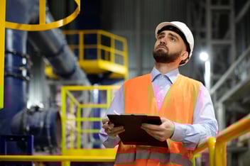 Facility manager reviewing onboarding checklist for CMMS software