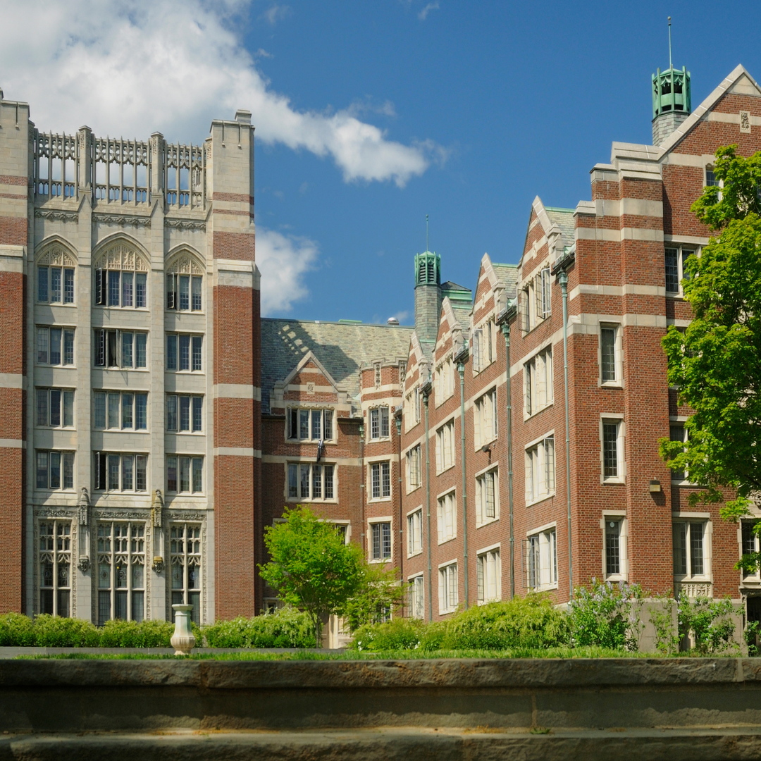 School maintenance team inspecting HVAC system in classroom